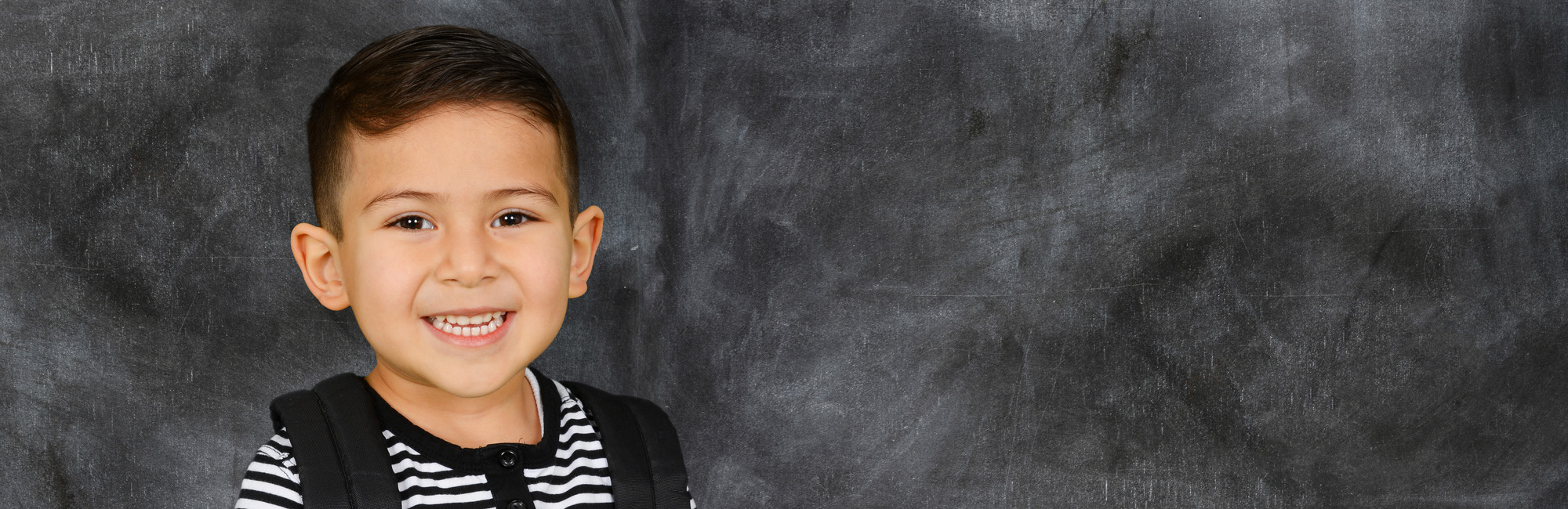 happy_child_student_blackboard.jpg